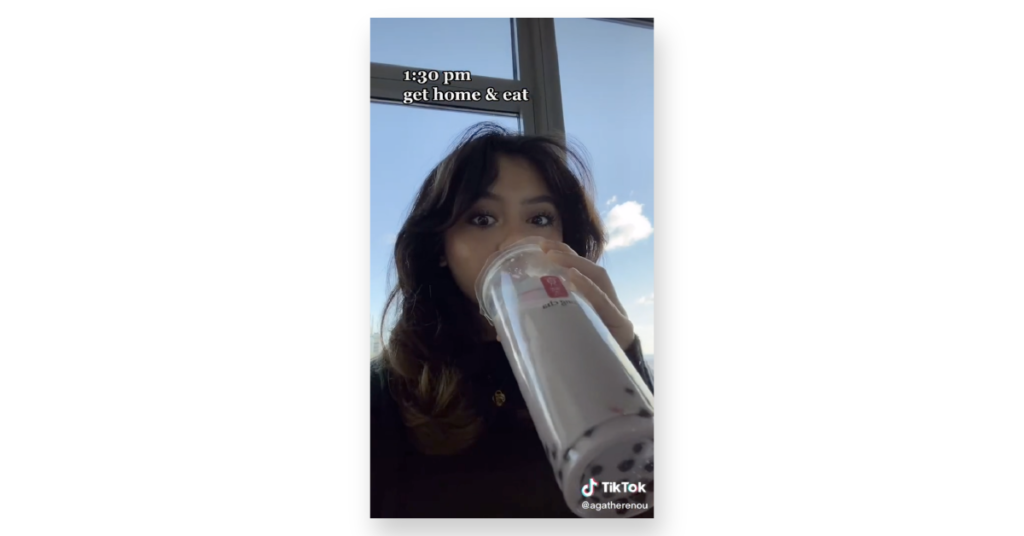 Woman drinking from large cup