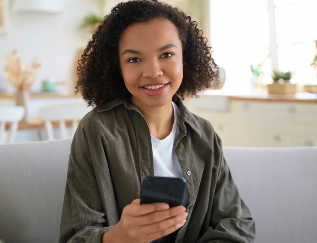 Kid holding Bark Phone advanced plan