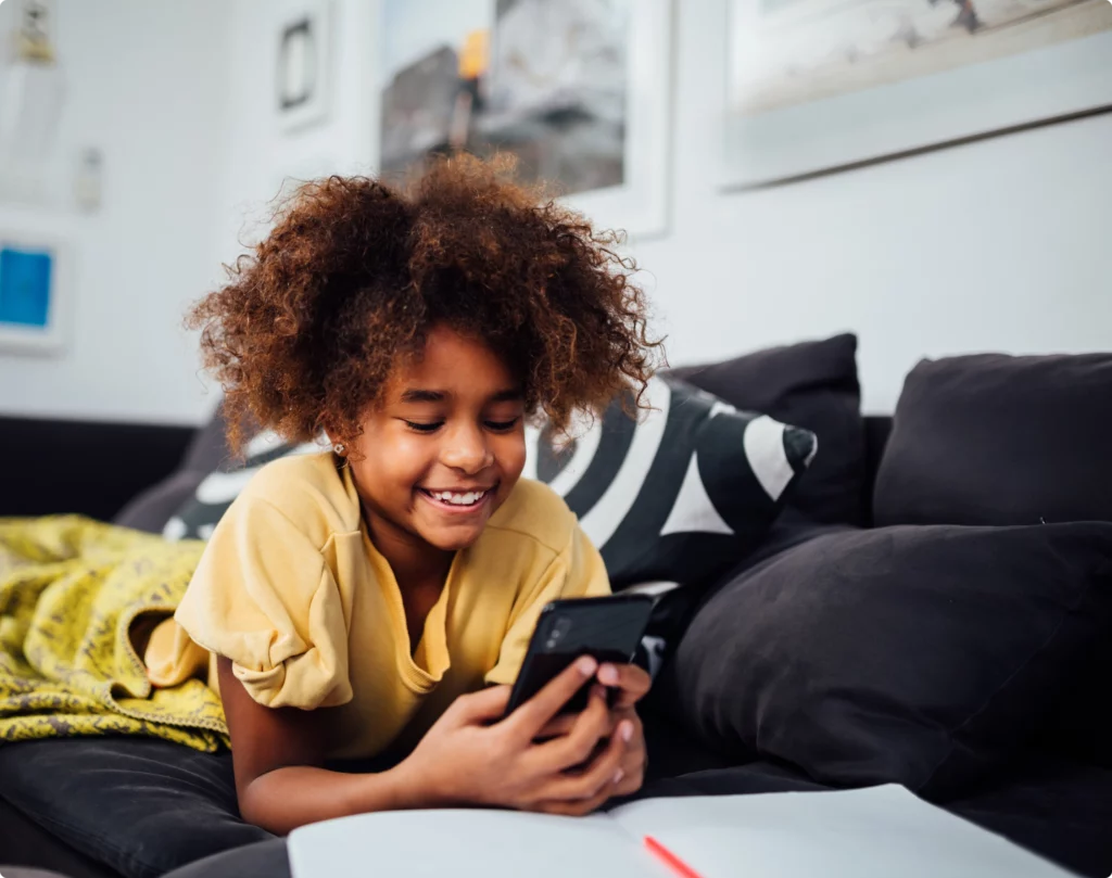 Kid holding Bark Phone starter plan