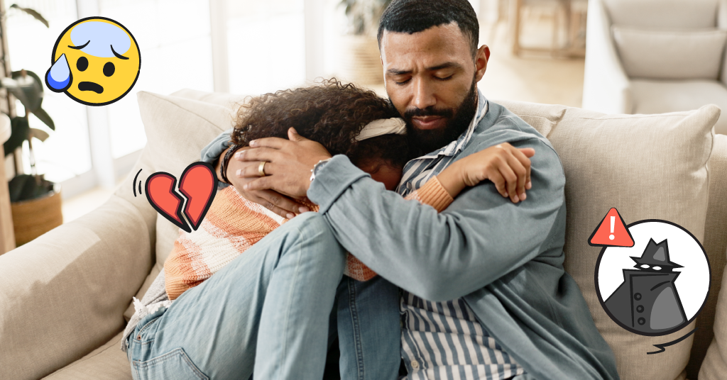 A distressed daughter hugs her father on the couch.